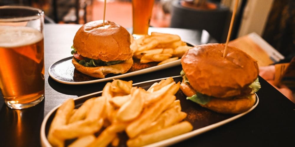 Hamberger and French fries at a bar and grill restaurant.